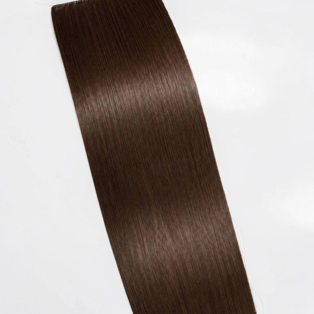 Dark brown human hair ponytail extension in a rich deep brunette shade