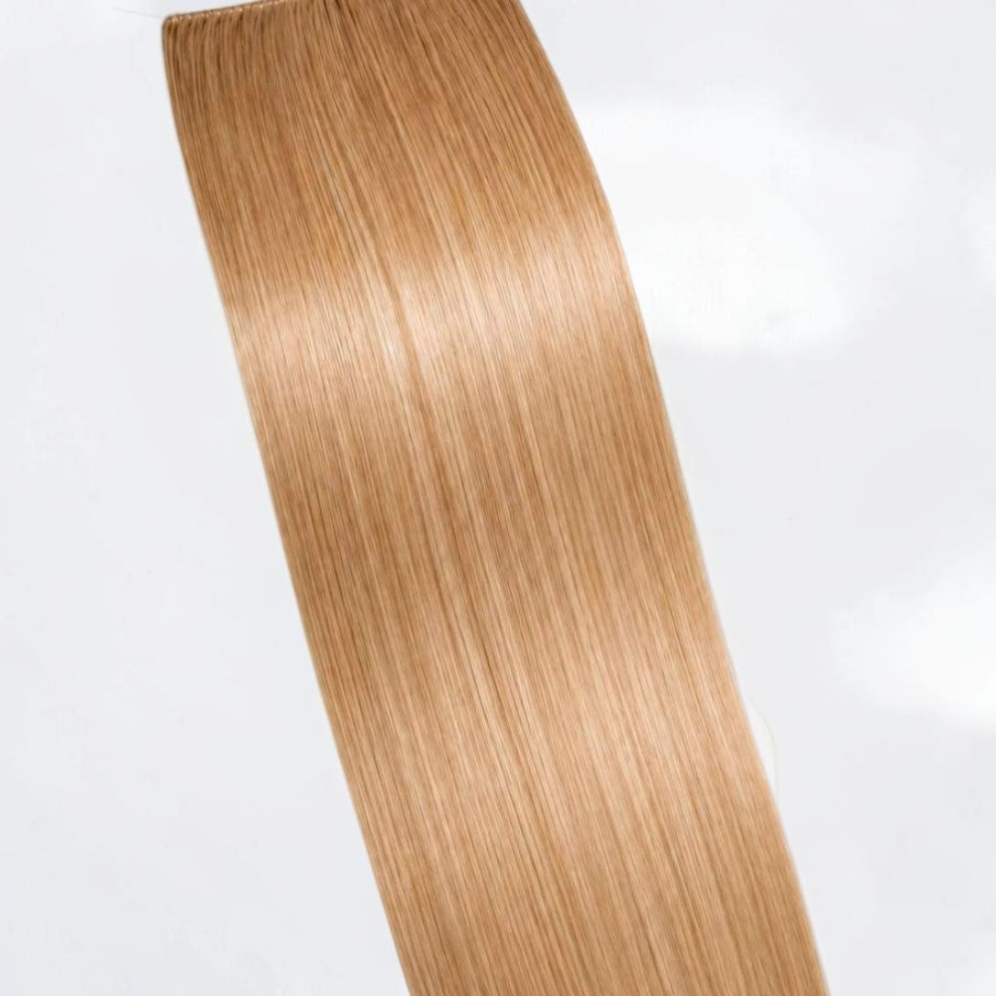 Honey blonde human hair ponytail extension in a warm golden blonde shade