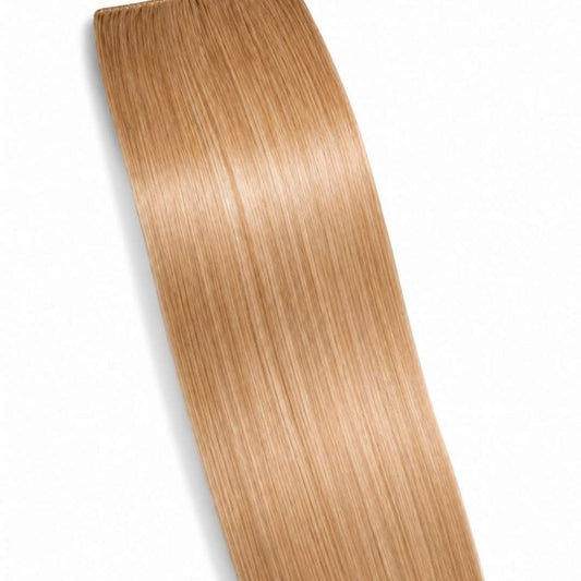 A Honey Blonde ponytail hair extension displayed on a clean white background, showing its smooth Remy Human Hair texture.