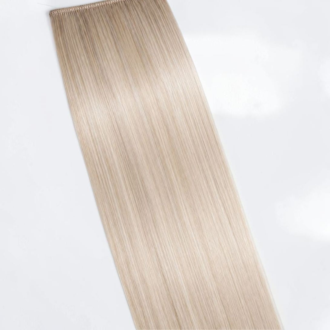 Cool icy blonde human hair ponytail extension in a pale platinum shade