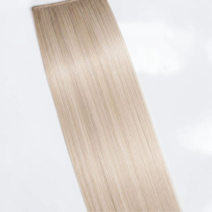 Cool icy blonde human hair ponytail extension in a pale platinum shade