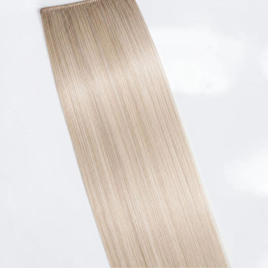 Cool icy blonde human hair ponytail extension in a pale platinum shade