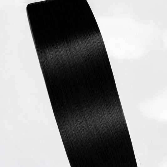 Jet black human hair ponytail extension in a deep natural black shade