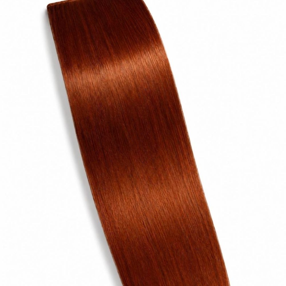A Copper ponytail hair extension displayed on a clean white background, showing its smooth Remy Human Hair texture.