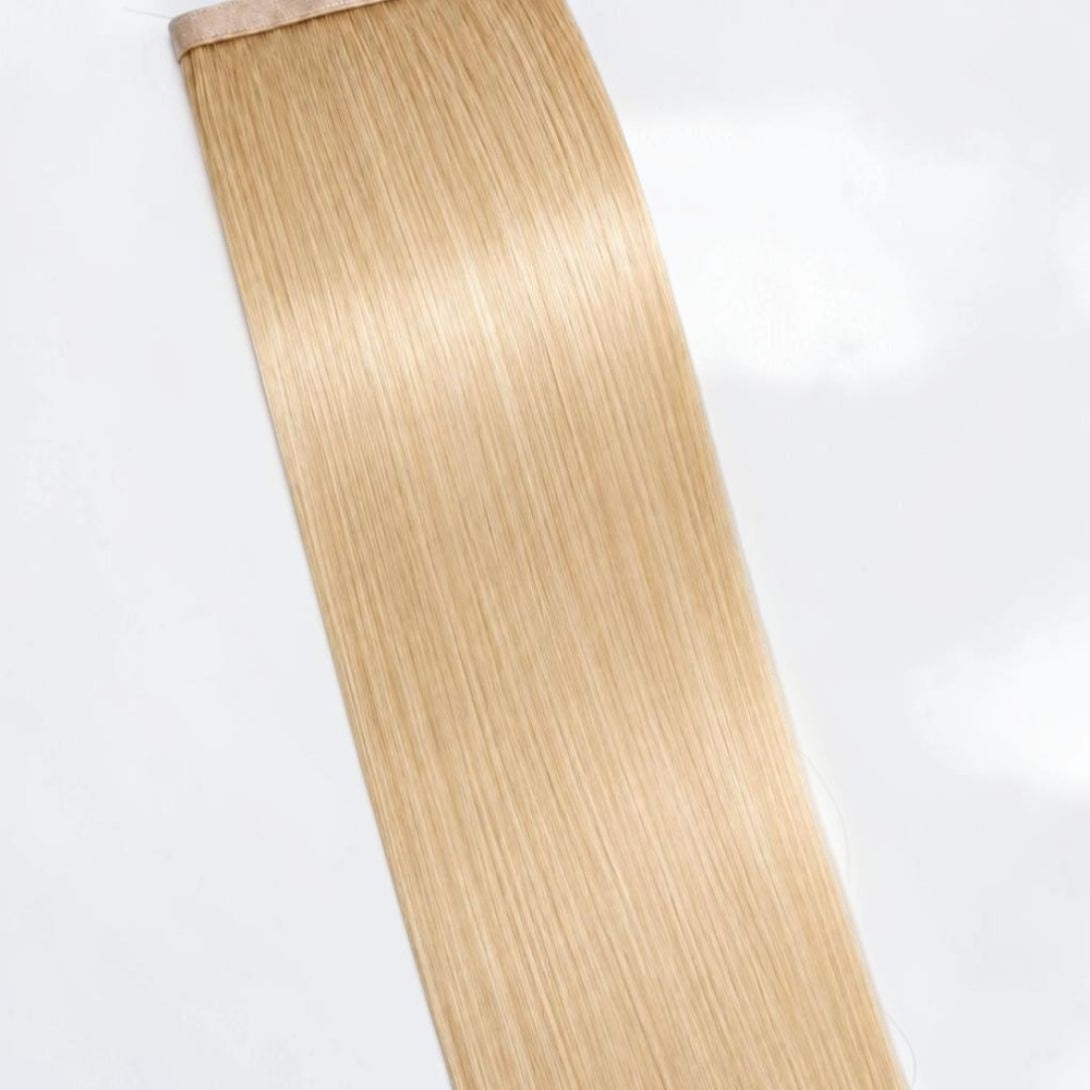 Vanilla blonde human hair ponytail extension in a soft creamy blonde shade