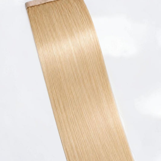 Vanilla blonde human hair ponytail extension in a soft creamy blonde shade